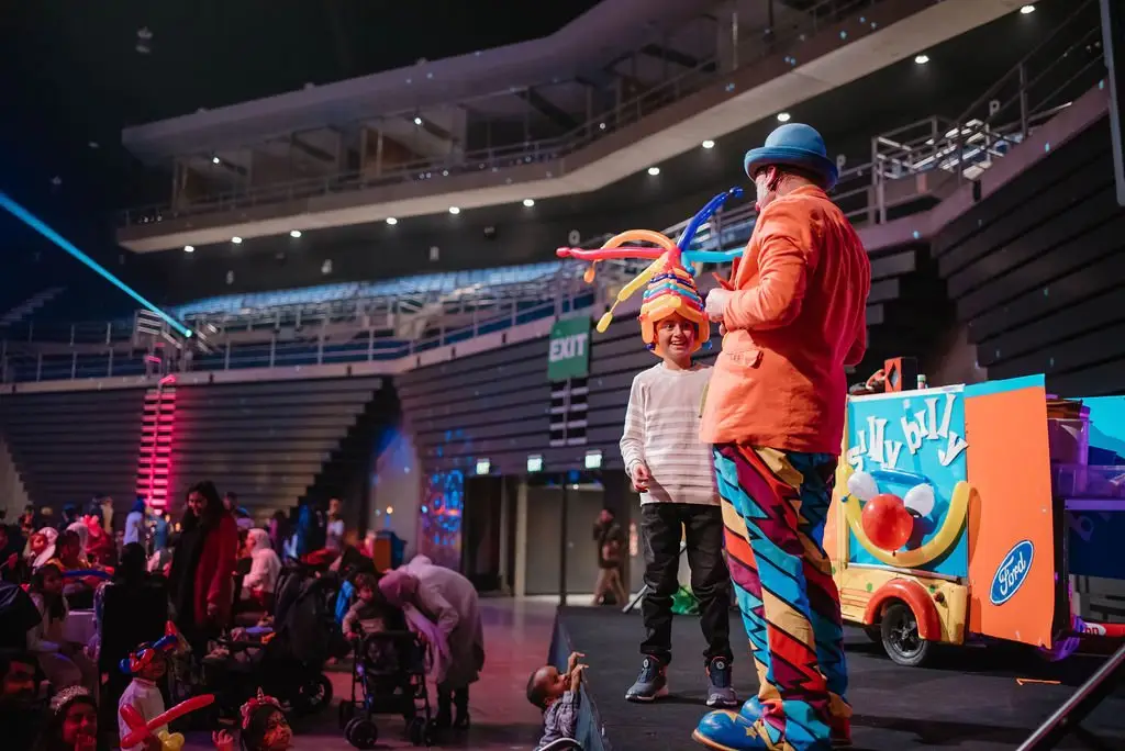 Silly Billy performing his interactive kids magic show on stage